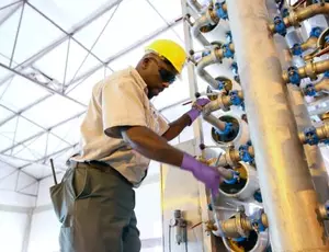 A technician makes seawater desalination
